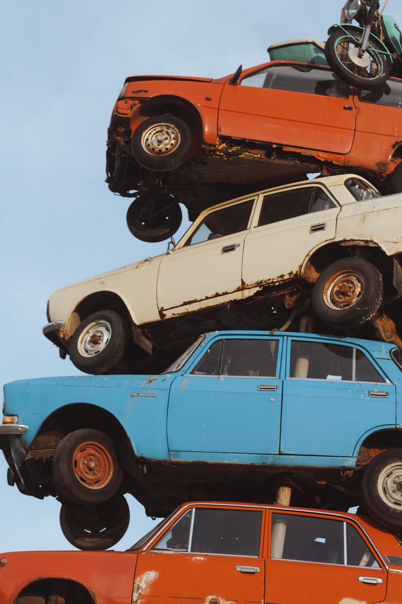 Stacked end-of-life vehicles at a scrapyard