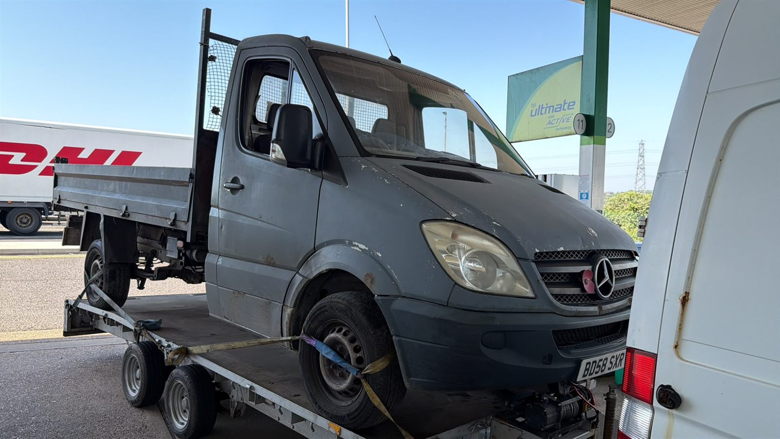 Mercedes Sprinter pickup on a trailer